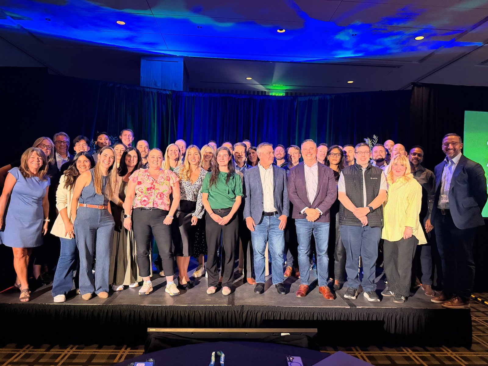 Attendees and the Upshop team on stage at Altitude 2026