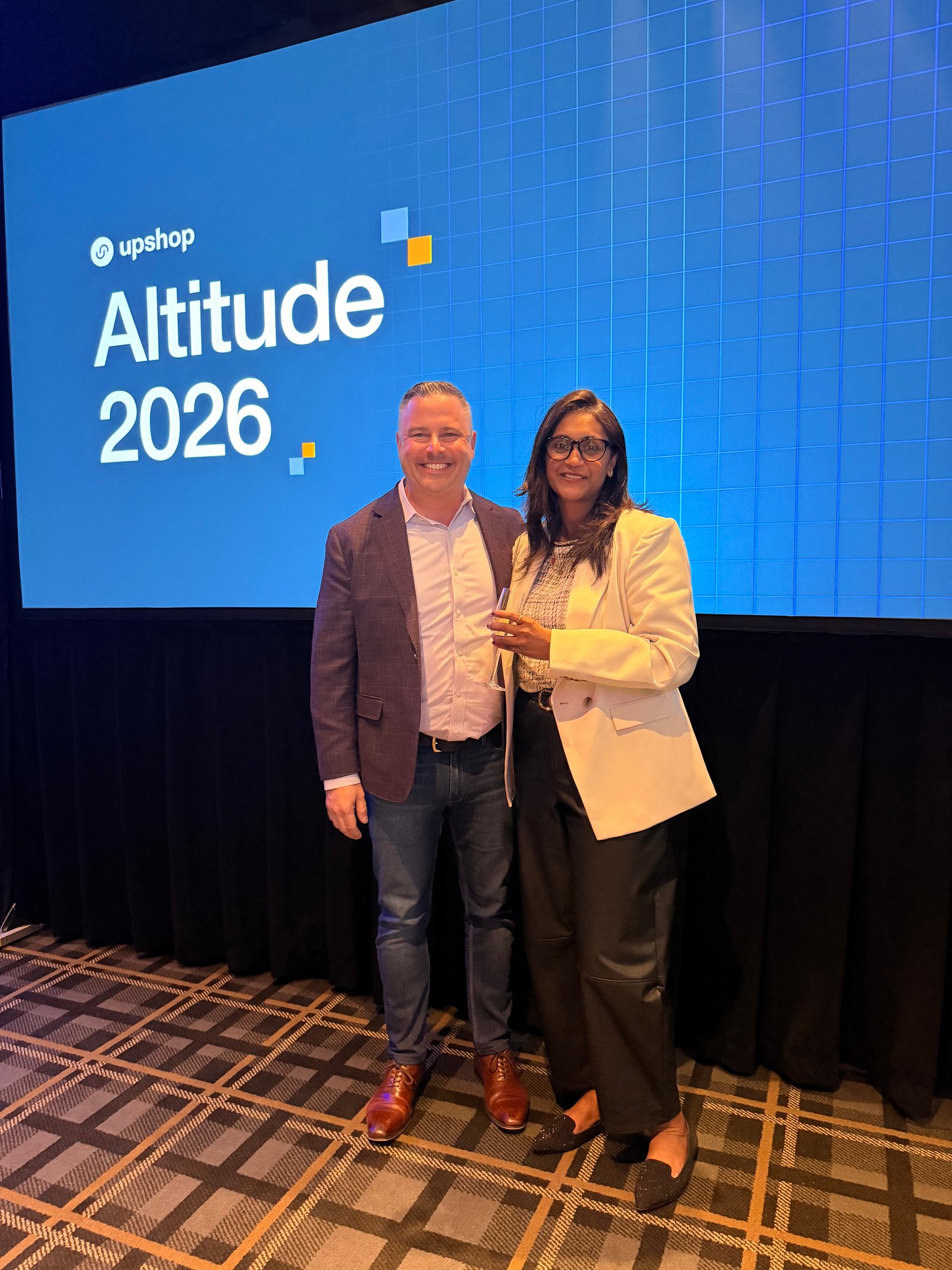 On stage in front of the Altitude 2026 screen